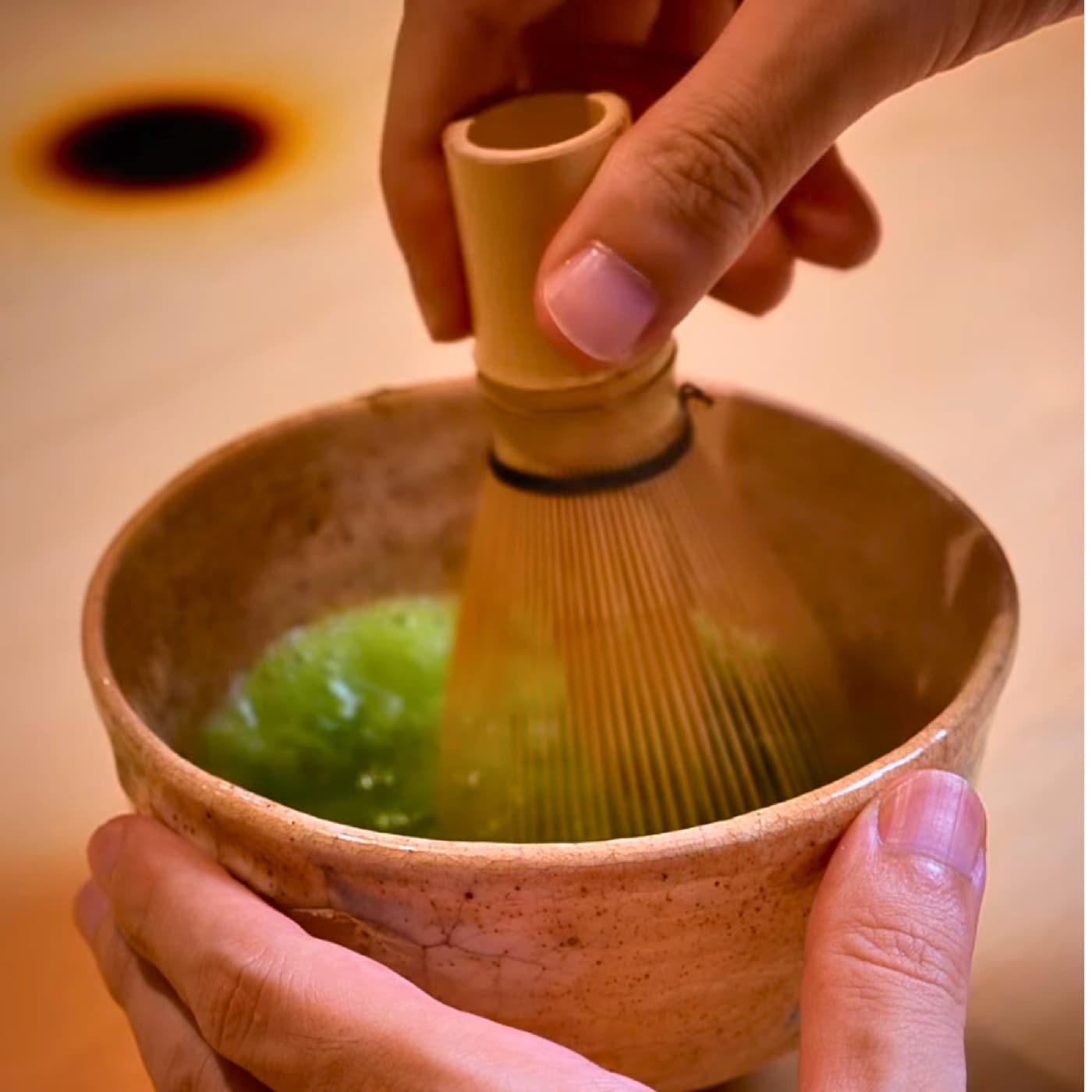 Matcha whisked by hand in a ceramic bowl